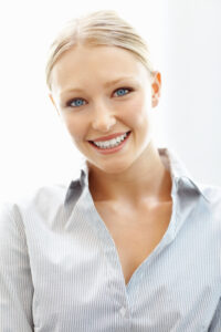 Smiling woman is calm and comfortable because dental sedation helped with her fear of the dentist in Centreville, VA