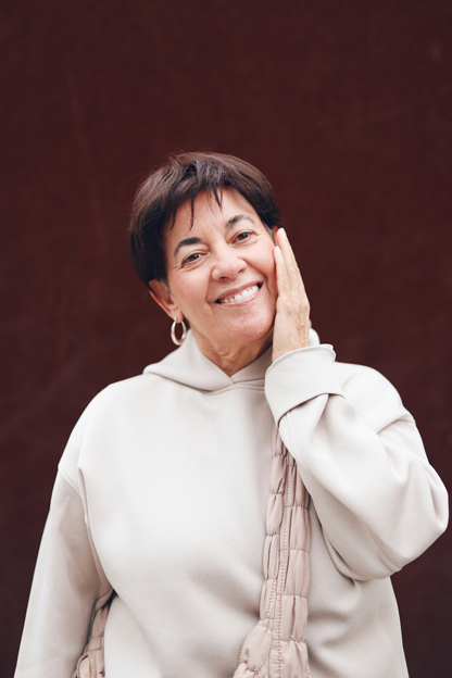 Smiling Manassas dental implant patient shows off her new smile
