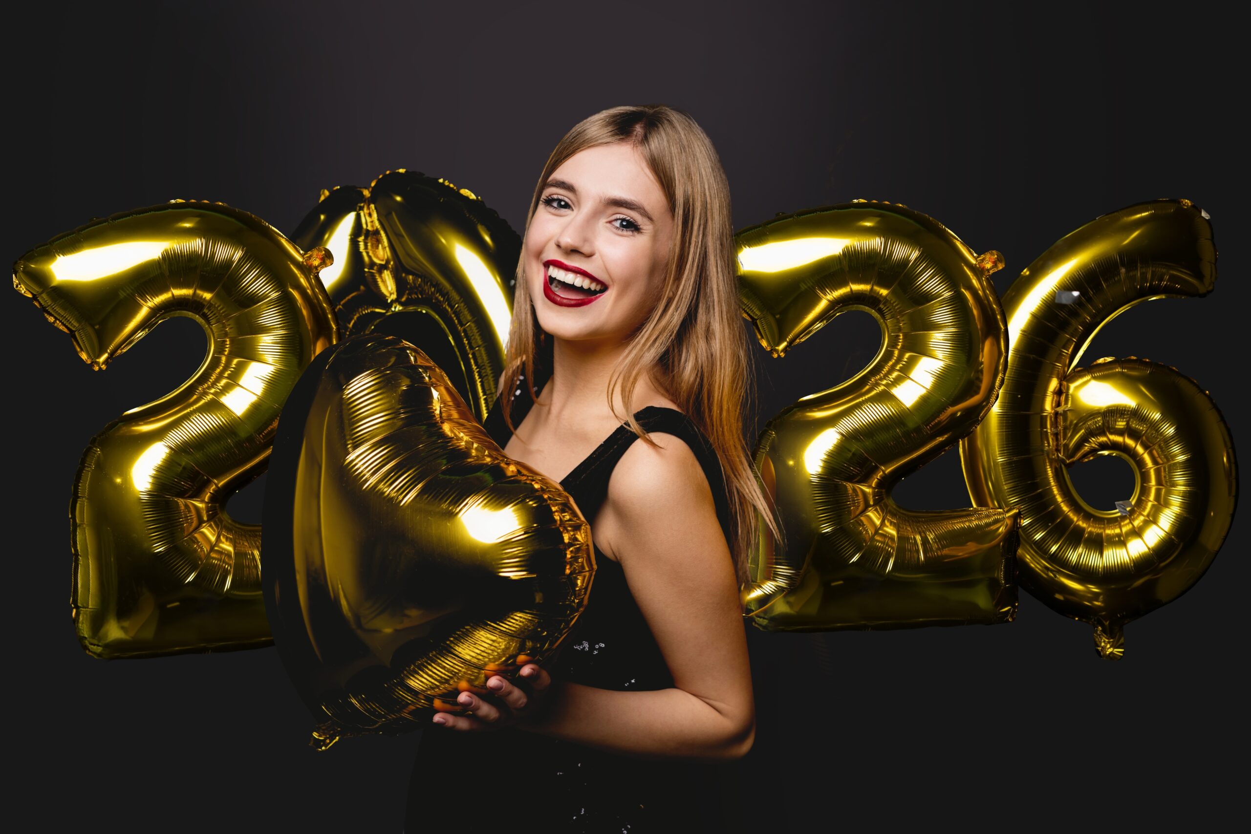 New Year 2026. Woman With Balloons Celebrating At Party, showing perfect smile