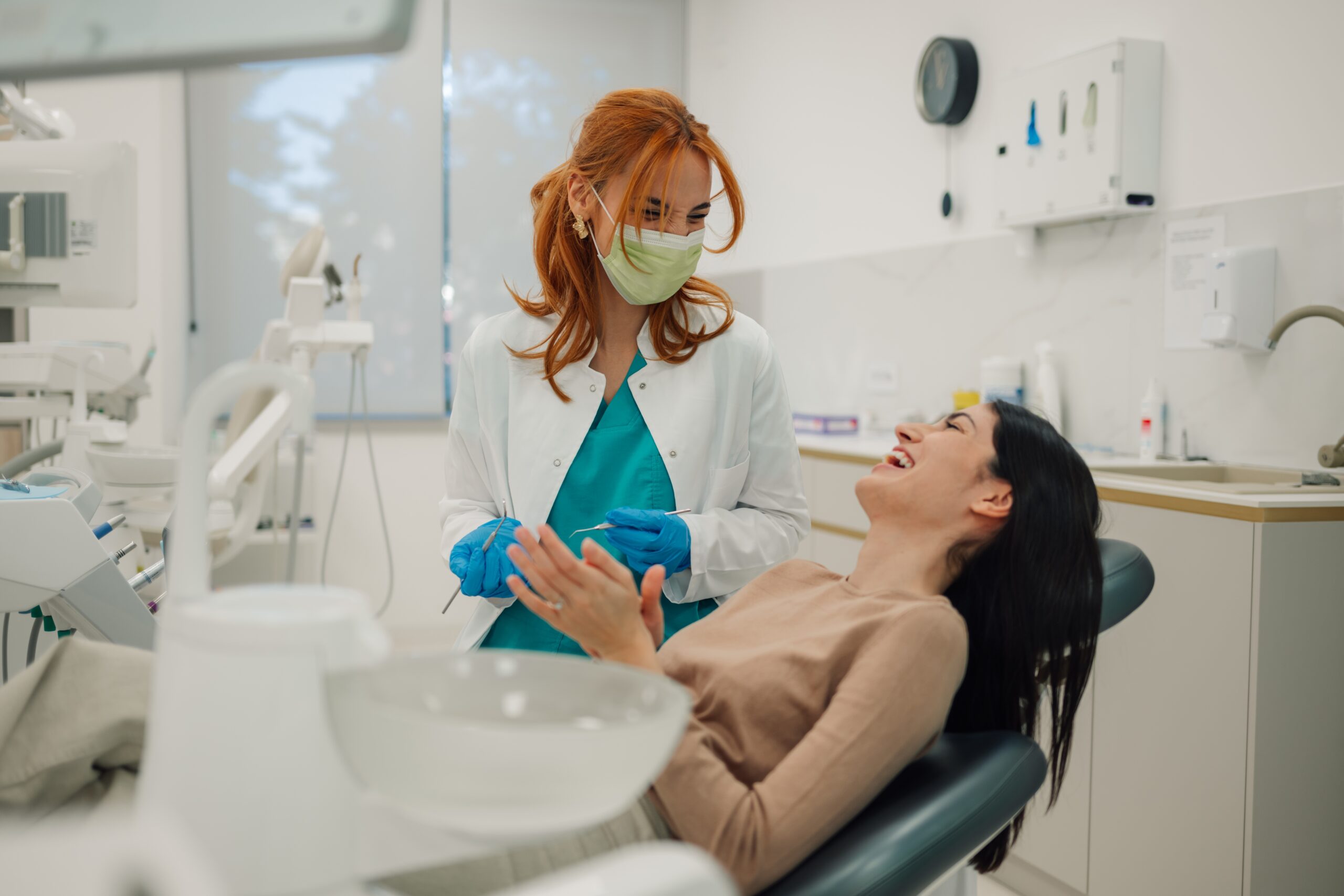 young woman laughing in a modern dental office
